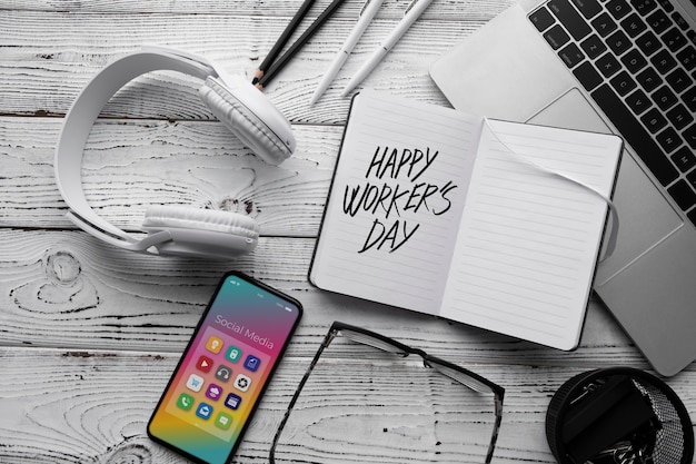 Free photo international worker's day with device on desk