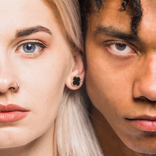 Free Photo interracial young couple face looking at camera