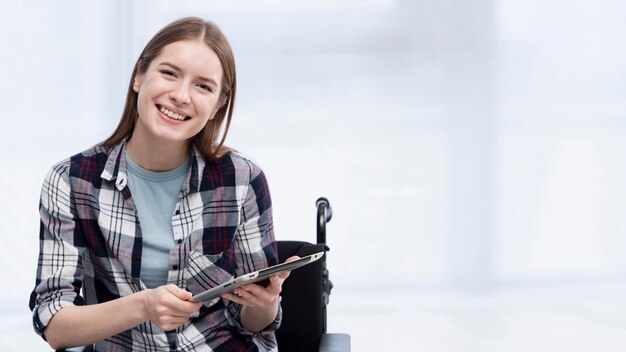 Invalid woman holding tablet