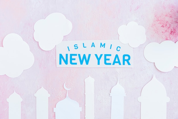 Islamic New Year paper in clouds over mosque