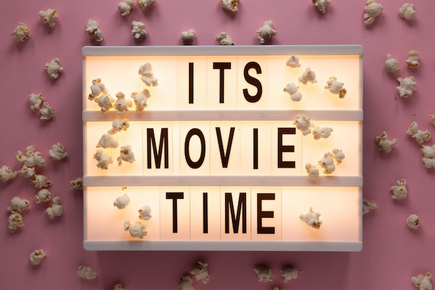 Free photo it's movie time illuminated lettering