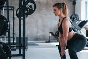 Free photo do it smoothly.  gorgeous blonde woman in the gym at her weekend time