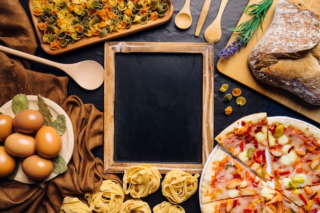 Italian food composition with slate in middle