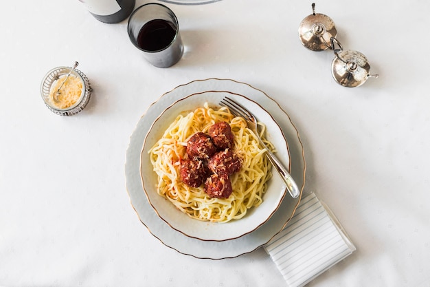 Free Photo italian pasta with meatballs in white ceramic bowl