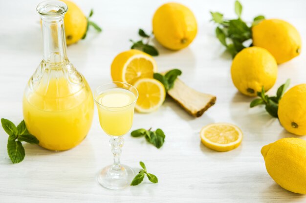 Italian traditional liqueur limoncello with lemon