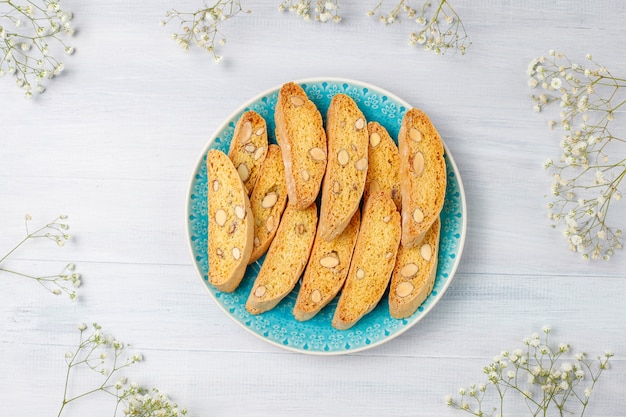 Italian tuscan traditional cookies cantuccini with almonds, a cup of coffee on light