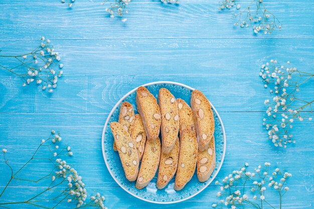 Italian tuscan traditional cookies cantuccini with almonds, a cup of coffee on light