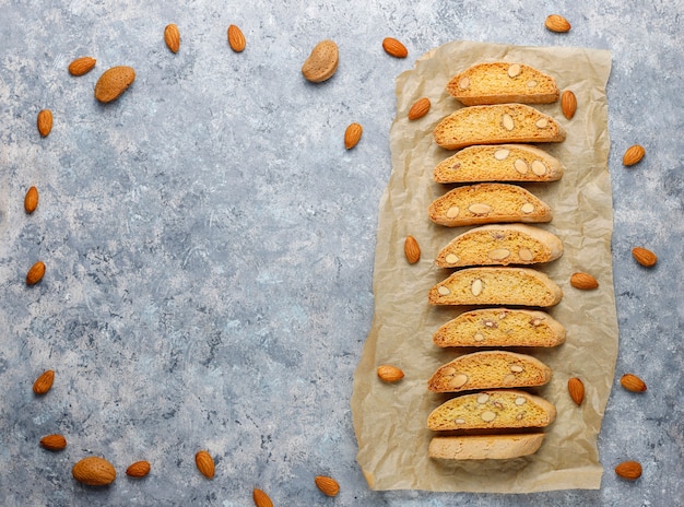 Italian tuscan traditional cookies cantuccini with almonds on grey concrete table