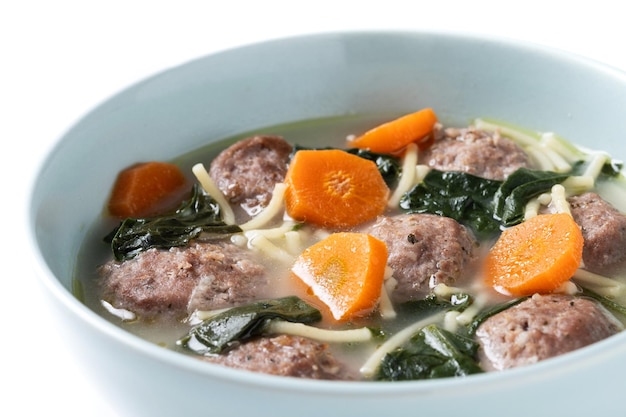 Free photo italian wedding soup with meatballs and spinach isolated on white background