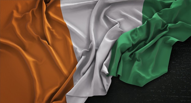 Ivory Coast Flag Wrinkled On Dark Background 3D Render