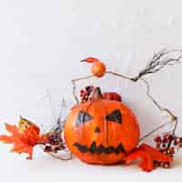 Free photo jack-o-lantern and autumn decorations