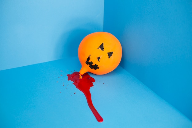 Free Photo jack-o-lantern balloon in pool of blood