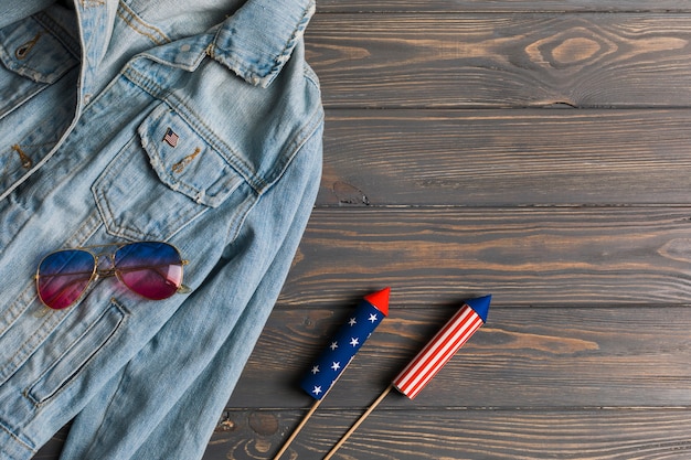 Jacket, sunglasses and fireworks on table