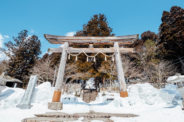 Japan Torii gate entrance shrine in snow scene