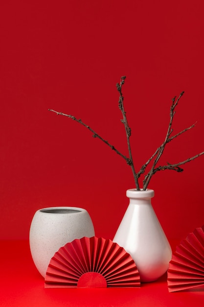 Free photo japanese aesthetic with branches in vase