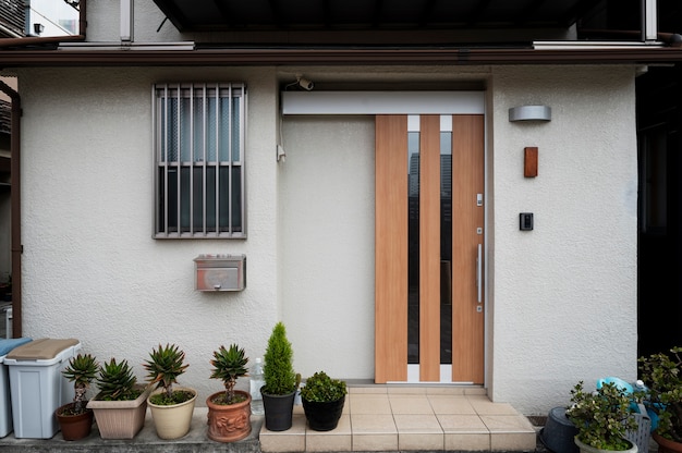 Free photo japanese culture house entrance and plants pots