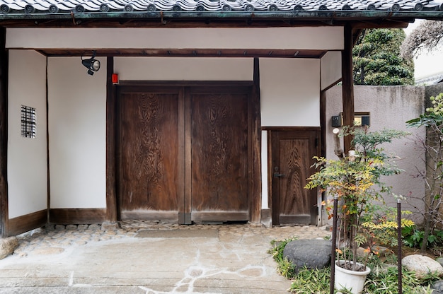 Free photo japanese culture house entrance with plants