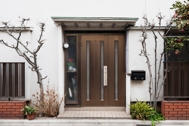 Free photo japanese house entrance with trees