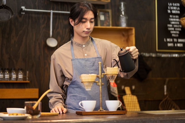 Japanese man making coffee in a restaurant