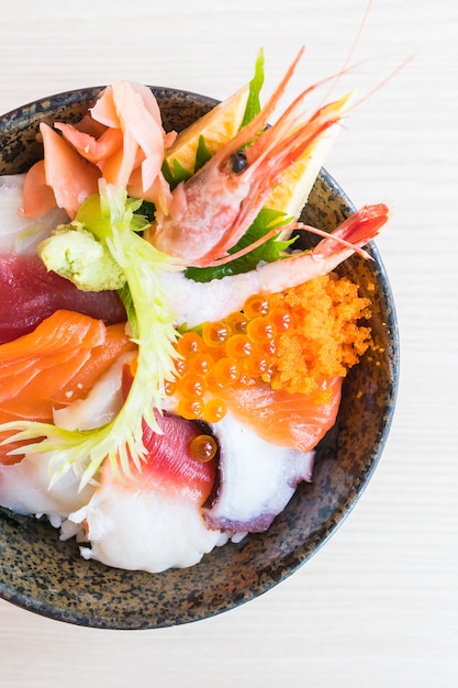 Free Photo japanese rice bowl with sashimi seafood on top