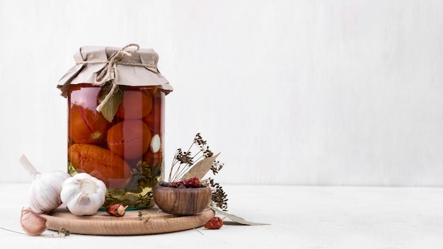 Jar with preserved vegetables and copy-space