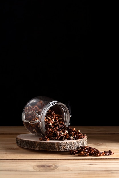 Free photo jar with walnuts on wooden board