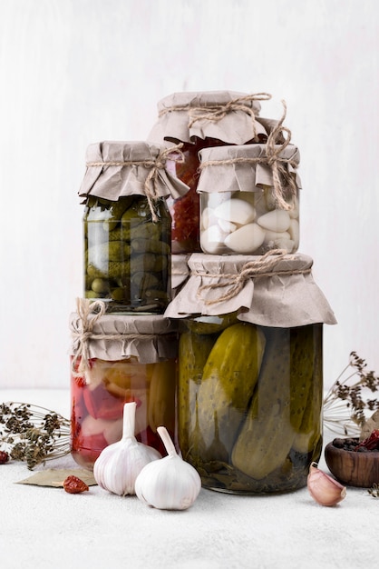 Jars arrangement with picked vegetables