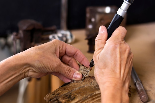 Free photo jeweler hands creating design for bracelet