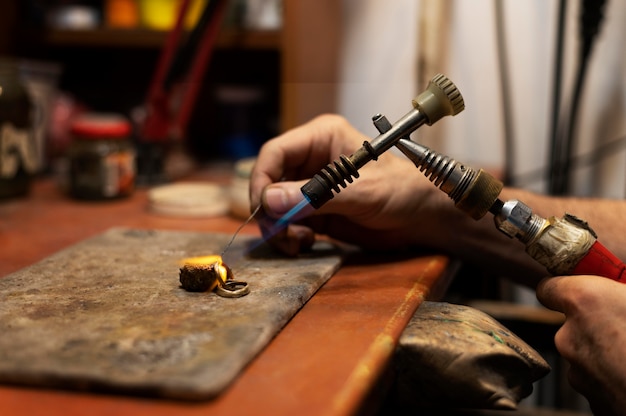 Jewelry maker working alone in the atelier