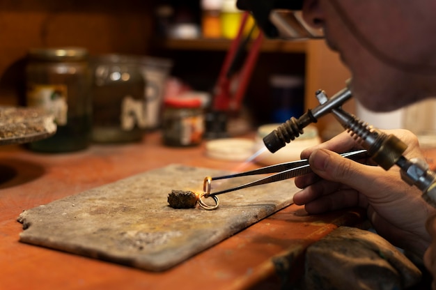 Jewelry maker working alone in the atelier