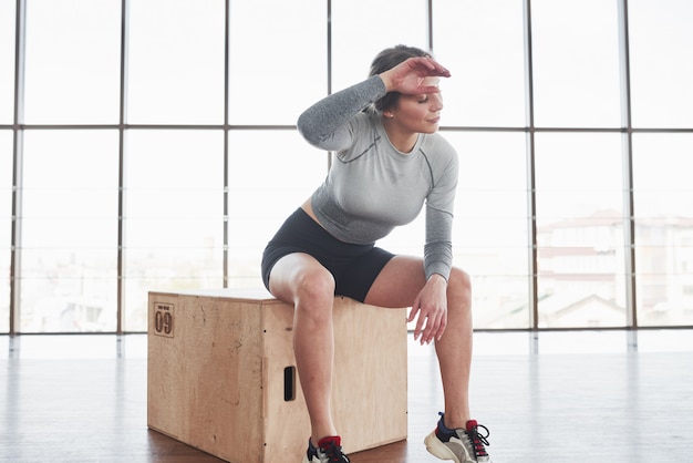 Job well done. Sportive young woman have fitness day in the gym at morning time