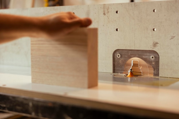 Free photo joiner using heavy machinery to craft furniture