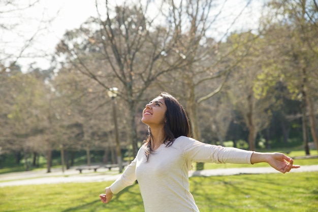 Joyful careless girl enjoying great weather