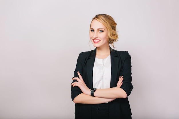 Free Photo joyful confident blonde businesswoman in suit smiling isolated. modern worker, secretary, executive, successful, cheerful mood.