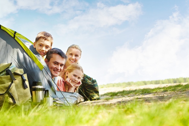 Joyful family camping in the park