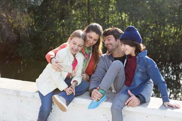 Joyful family taking selfie