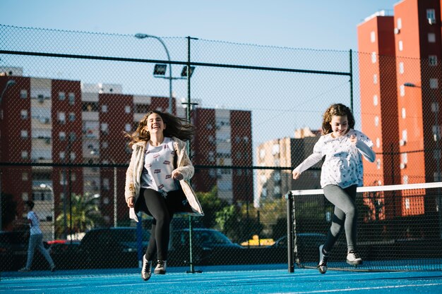 Joyful girls playing on rooftop