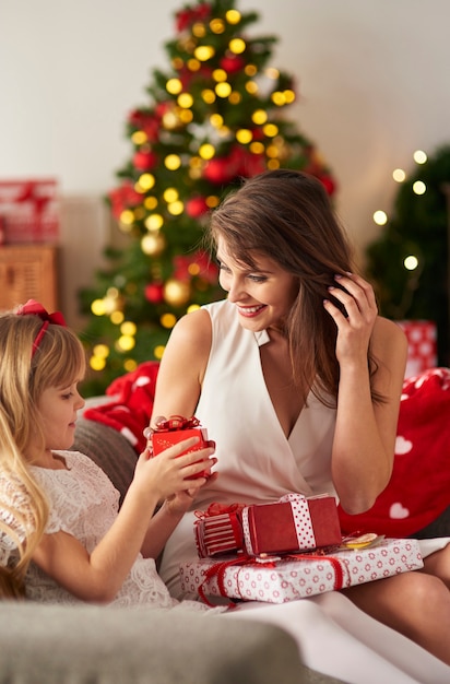 Joyful moment of handing over presents