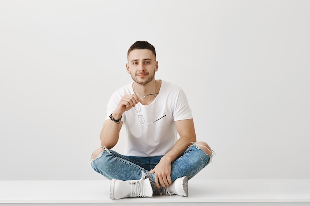 Free photo joyful young guy with glasses posing