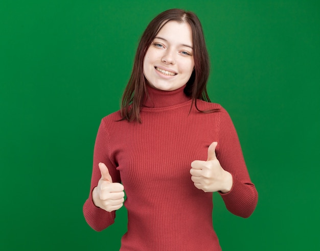 Free Photo joyful young pretty girl showing thumbs up 