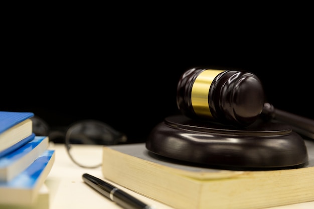 Free photo judges gavel on book and wooden table. law and justice concept background.