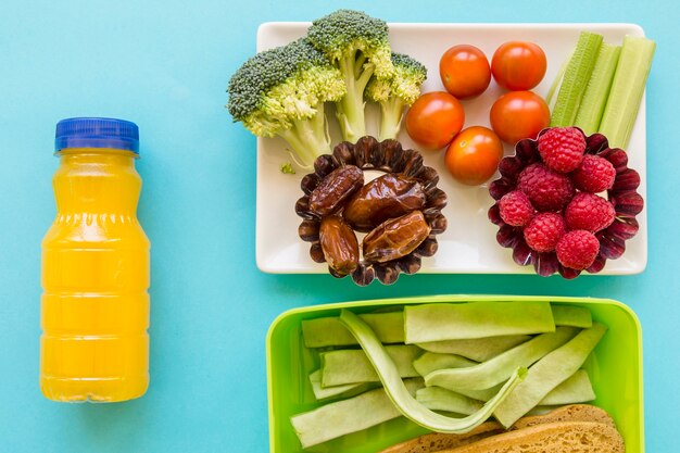 Juice near healthy food and lunchbox