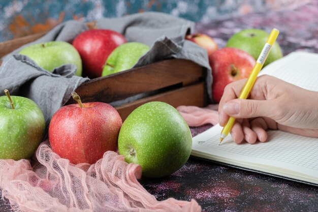 Juicy apples in a rustic wooden tray