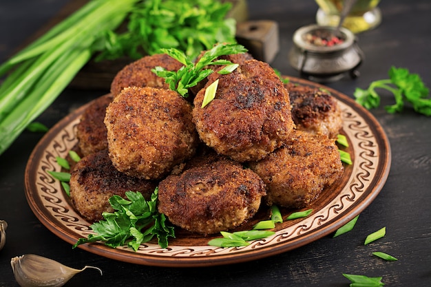 Free Photo juicy delicious meat cutlets on a dark table. russian cuisine.