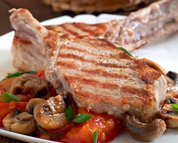 Juicy grilled pork steak on the bone