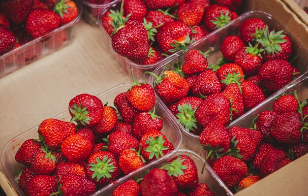 Juicy ripe strawberries on the supermarket counter