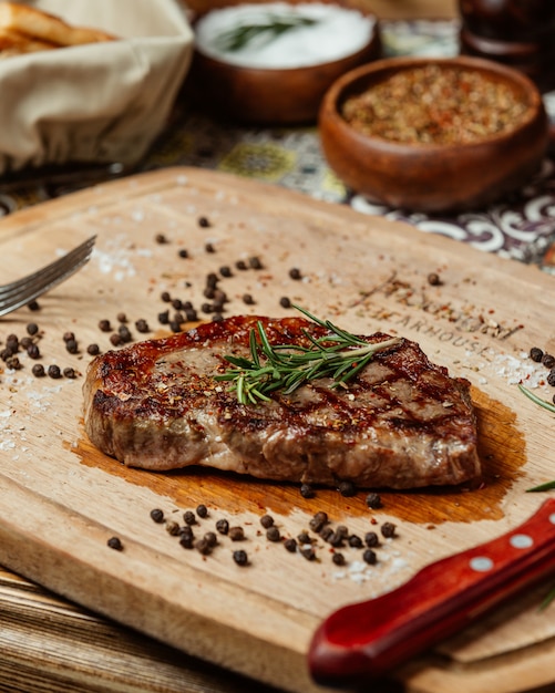 Juicy steak with rosemary and black pepper