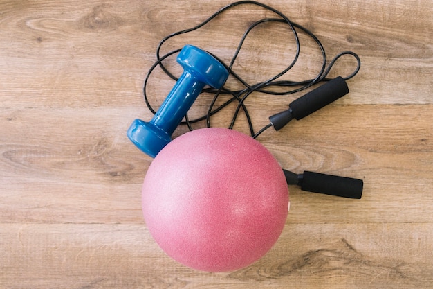 Free photo jump rope, dumbbell and rubber ball