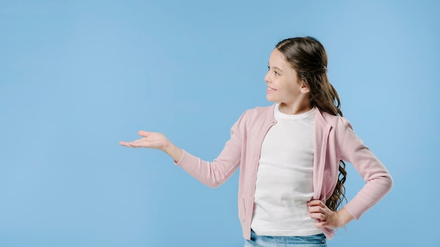 Junior presenting in studio and smiling