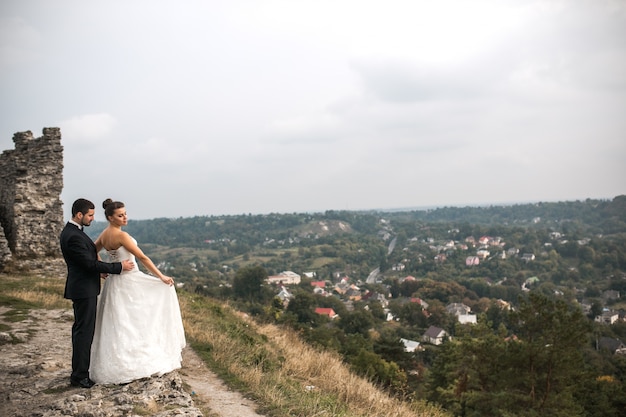 Free Photo just married over a few ruins